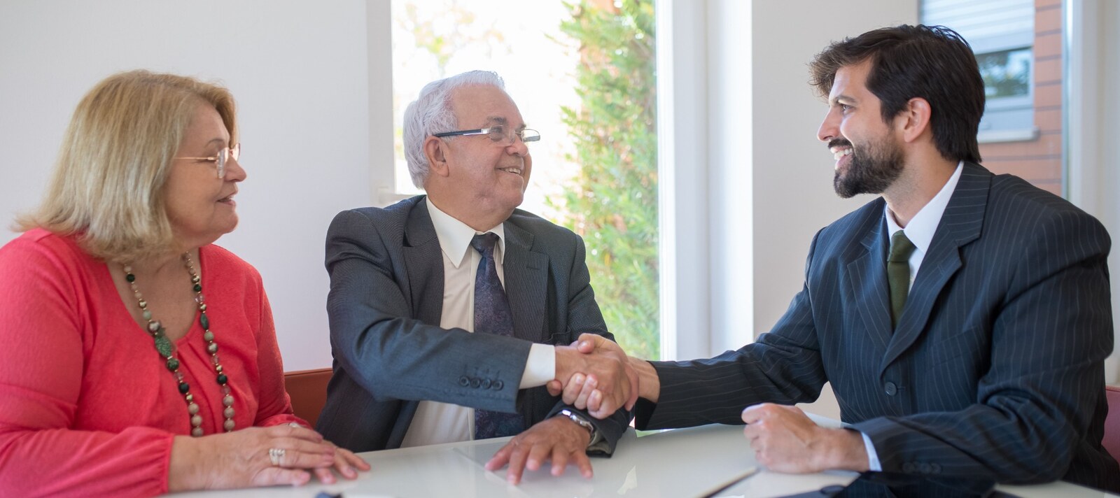 A couple discussing housing terms with a property professional